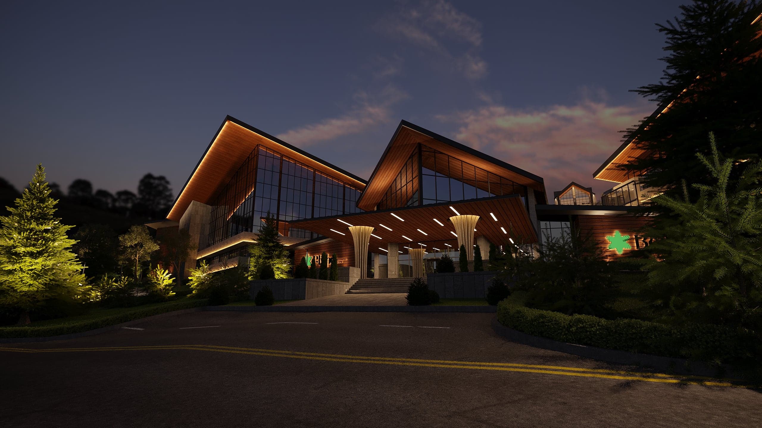 BELLIS Hotel & SPA main lodge illuminated at night — timber-lined pitched roofs and glazed entrance canopy