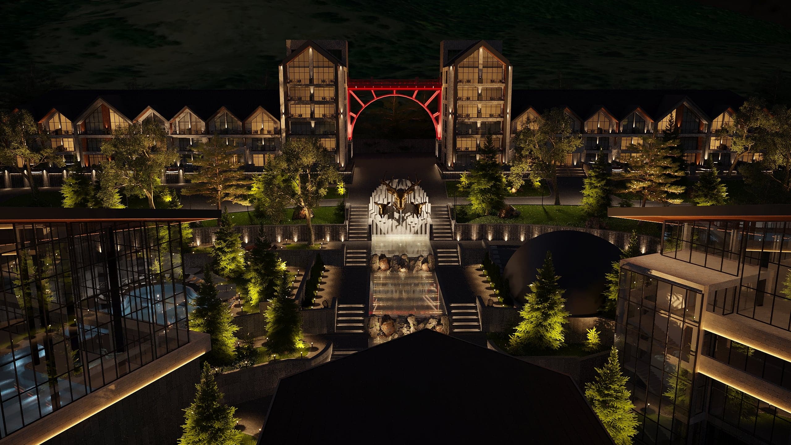 BELLIS Hotel & SPA main lodge illuminated at night — timber-lined pitched roofs and glazed entrance canopy