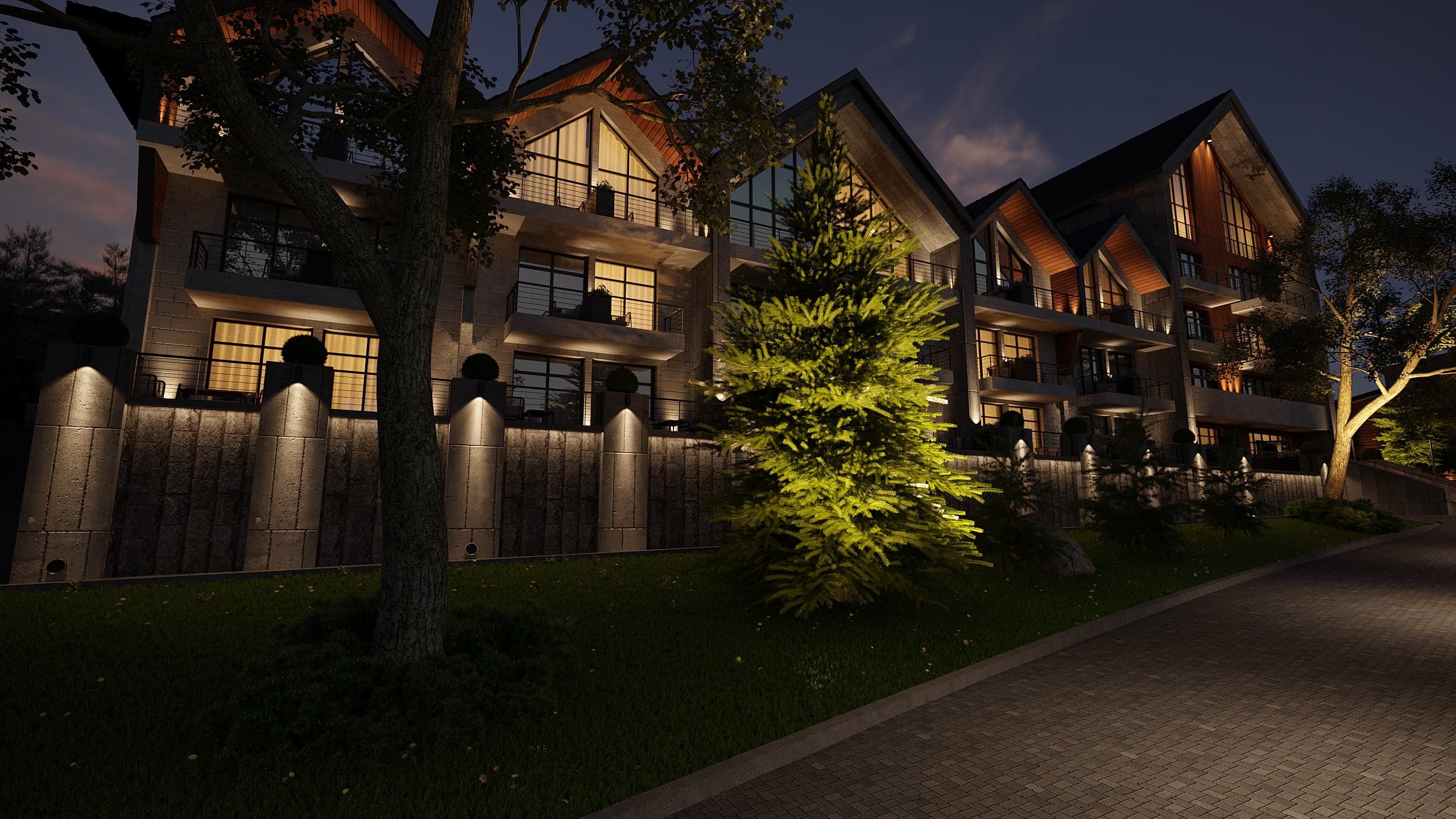 BELLIS Hotel & SPA resort exterior at night — warm architectural lighting across the mountain facade