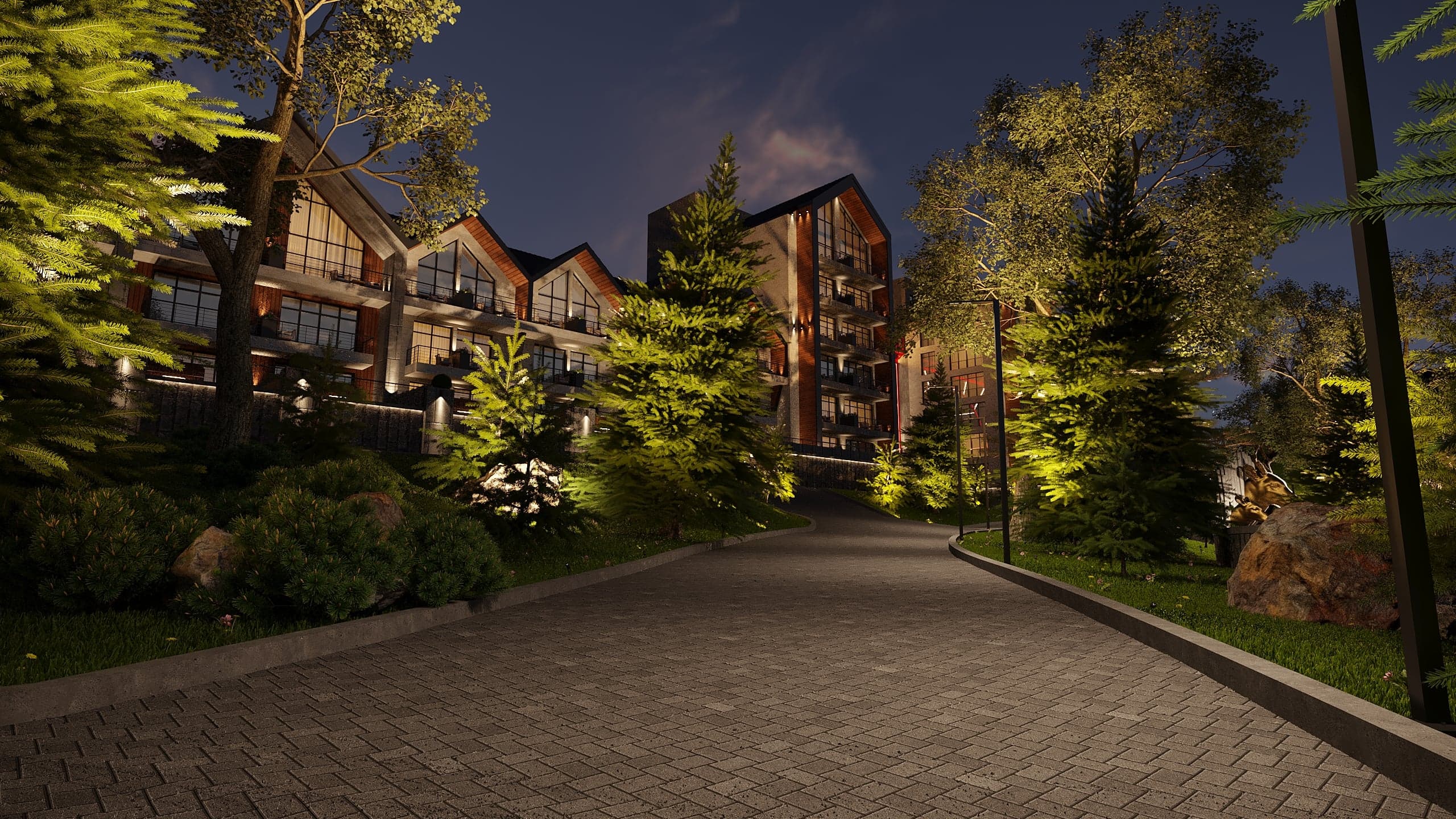 BELLIS Hotel & SPA main lodge illuminated at night — timber-lined pitched roofs and glazed entrance canopy