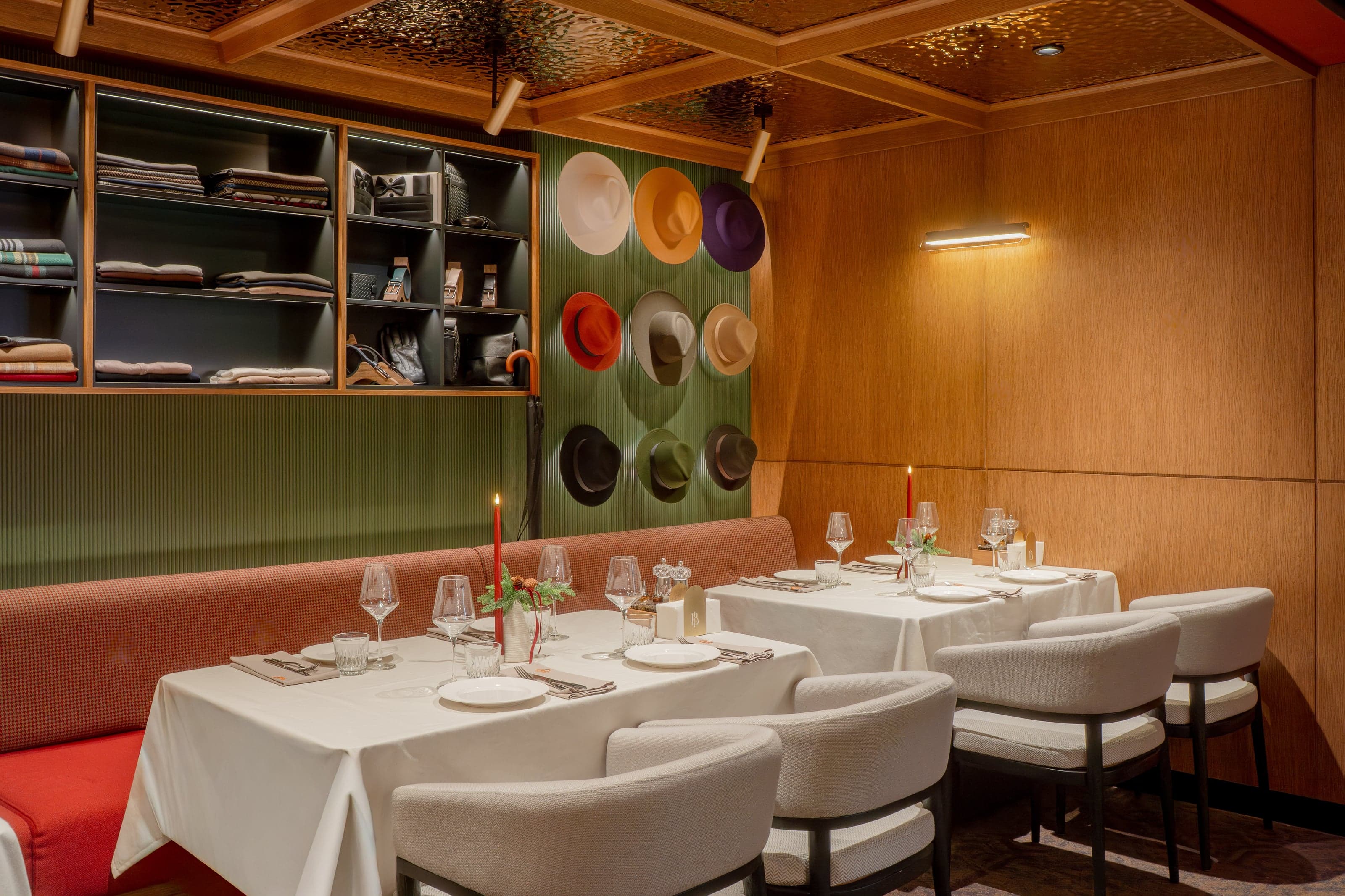 Bold Italic private dining room with a curated wall of fedora hats and accessories shelving
