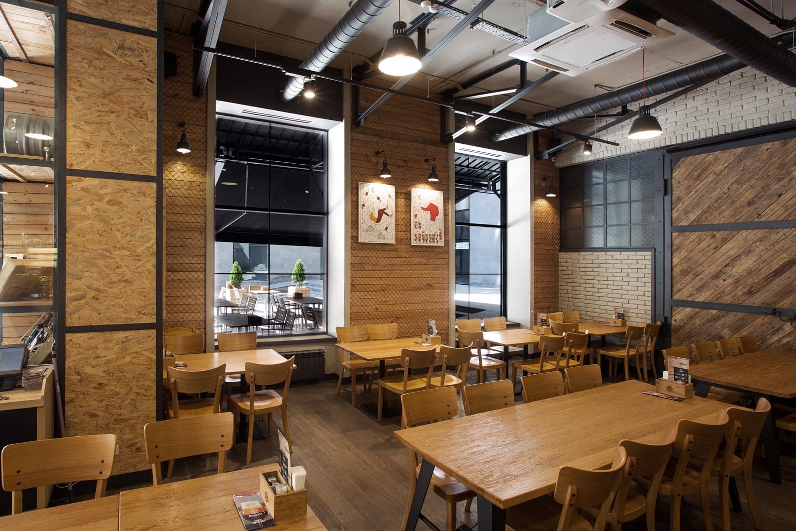 Craft brewery dining space with warm architectural lighting