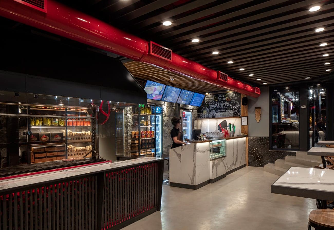 Modern grill restaurant with warm architectural lighting