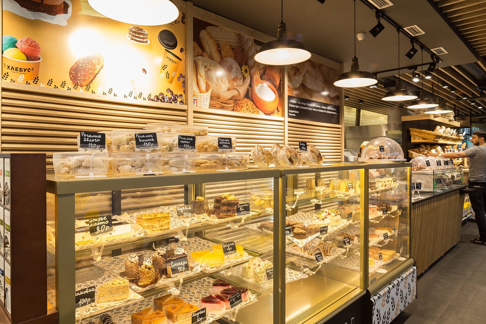 Café and bakery with warm architectural lighting
