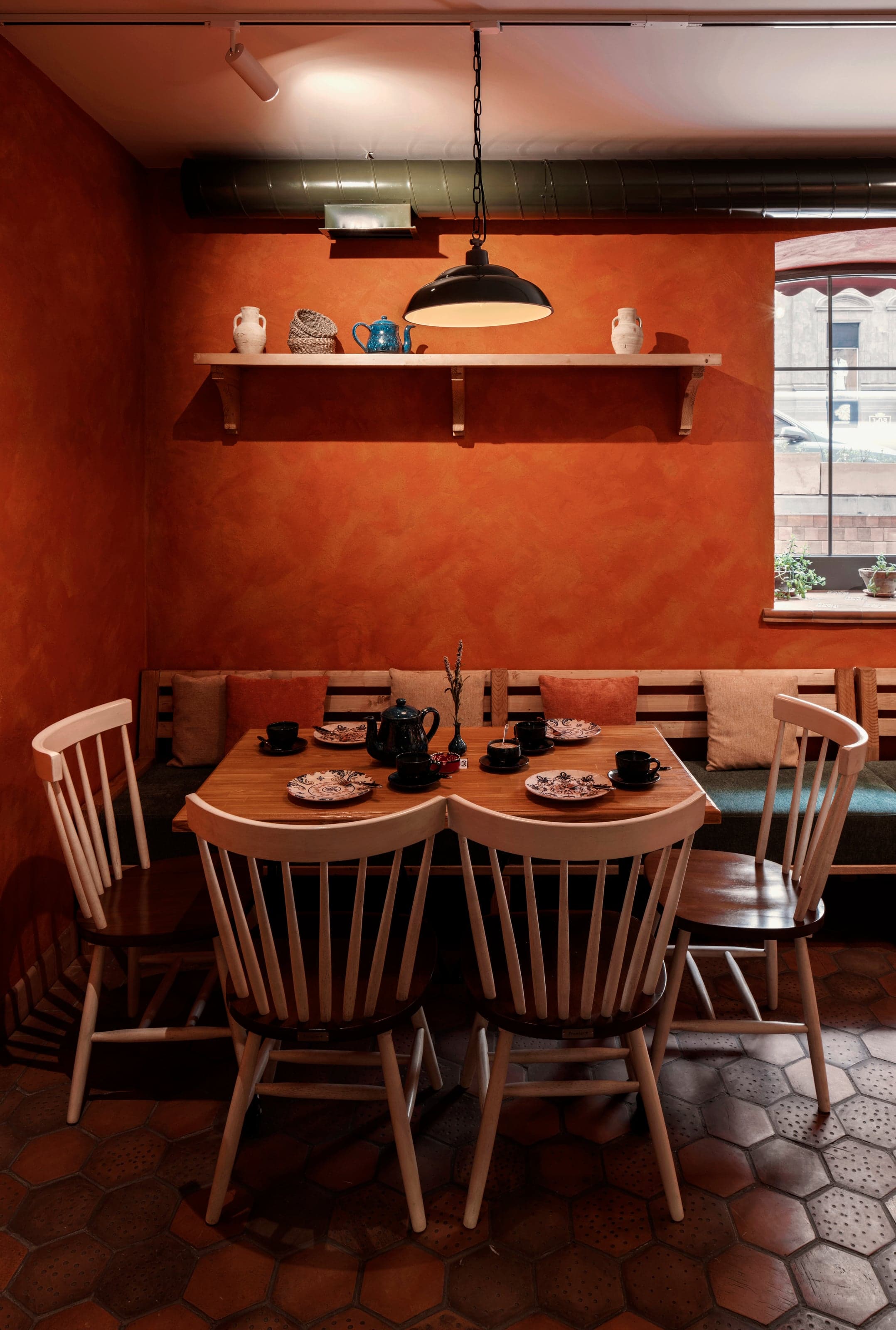 Open kitchen with traditional wood-fired pizza oven