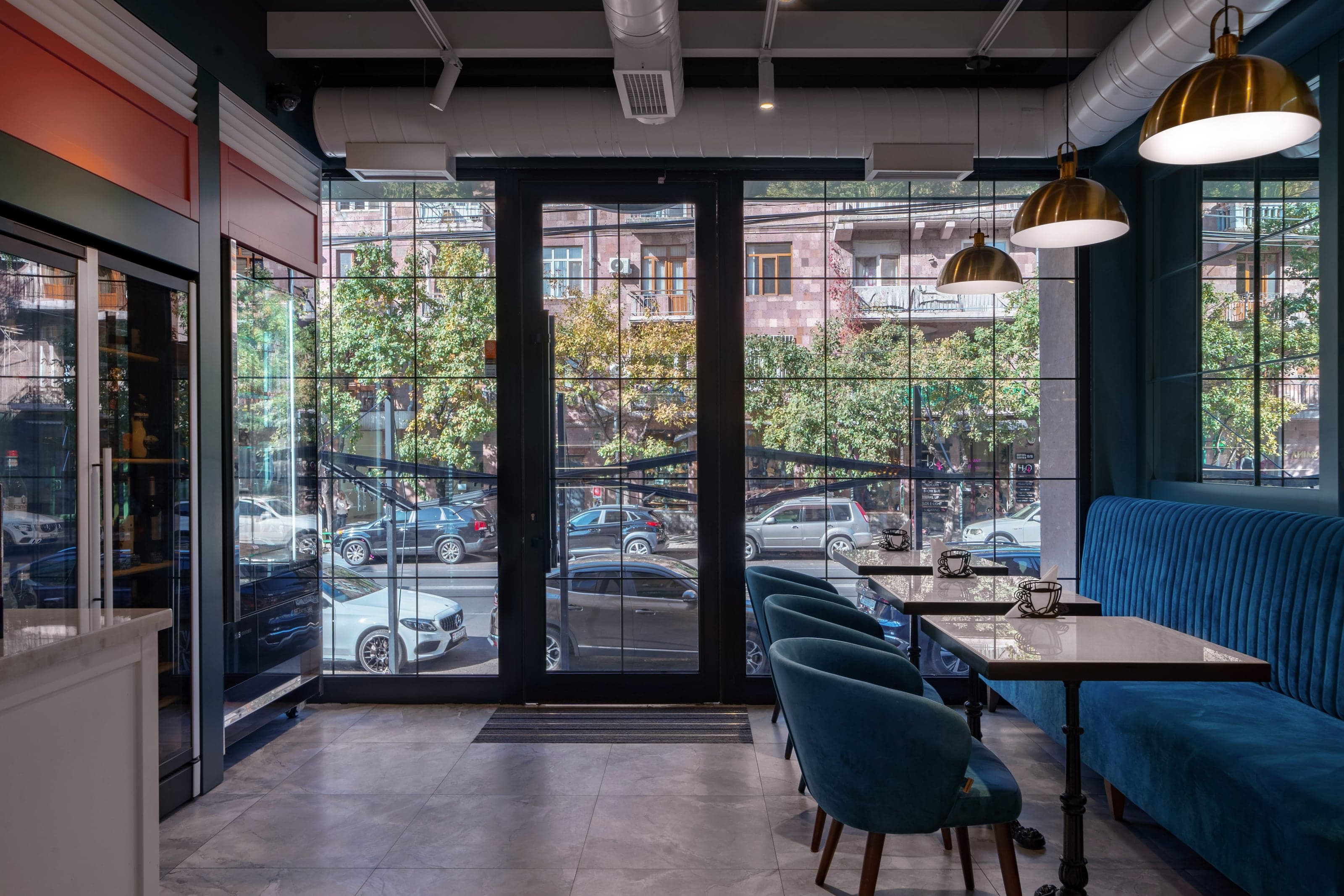 Hospitality interior with velvet seating and brass lighting
