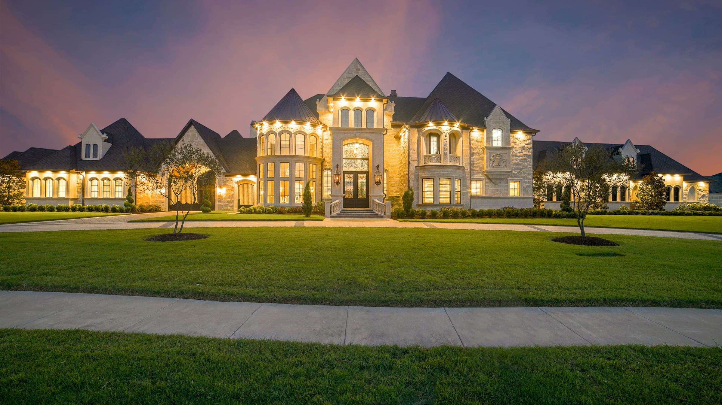 Grand building exterior illuminated at dusk