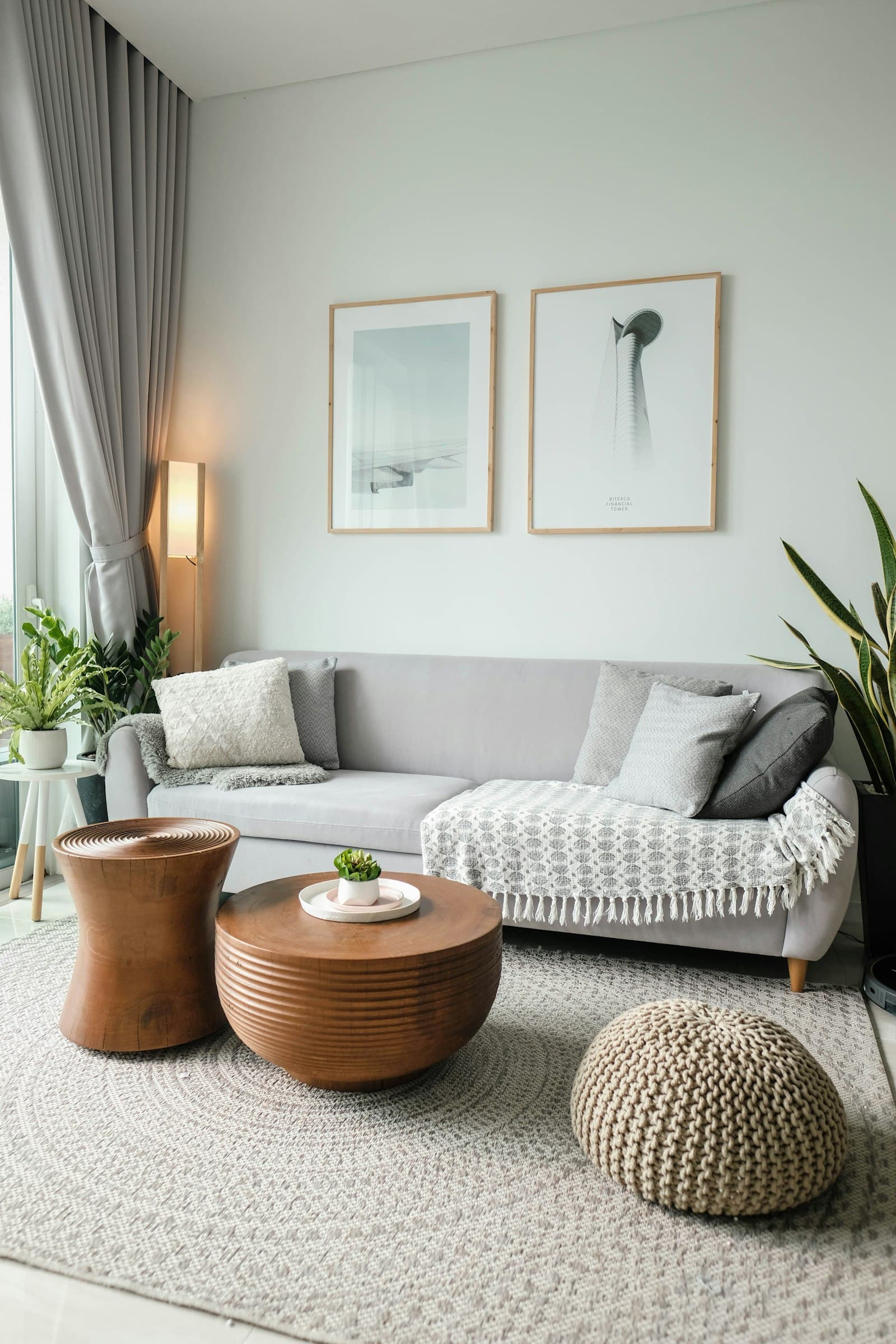 Private residence living room with grey sofa and large window